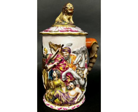 A Capodimonte porcelain tankard, decorated with battle scene, the handle formed from an elephants head and trunk, the cover s