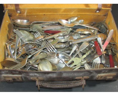 A Collection of mixed silver plate cutlery in a leather valise together with a vintage picnic basket with original plates, th