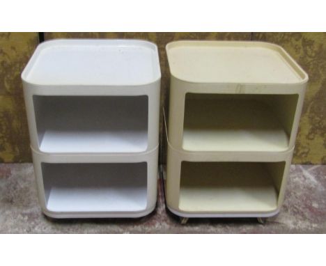An Anna Castelli for Kartell, a pair of three-tier lamp/bedside tables in a white and cream plastic 