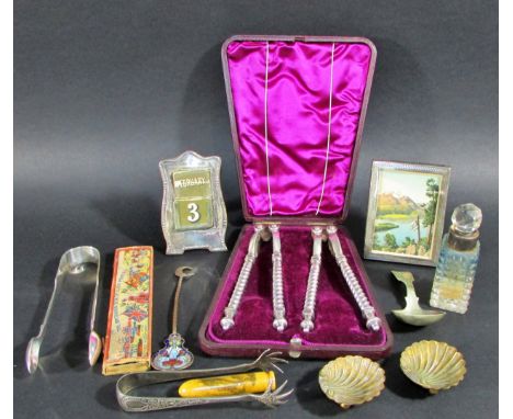 Mixed silver to include silver calendar frame, plated caddy spoon, nutcrackers etc 