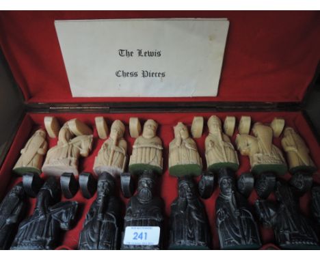 A carved box containing 'the Lewis chess pieces'