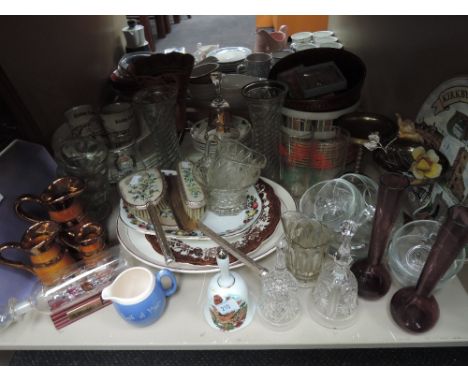 A shelf of ceramics, glass, prints and dressing table set