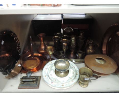 A shelf of copper and platedware including trays, goblets and coffee pot etc