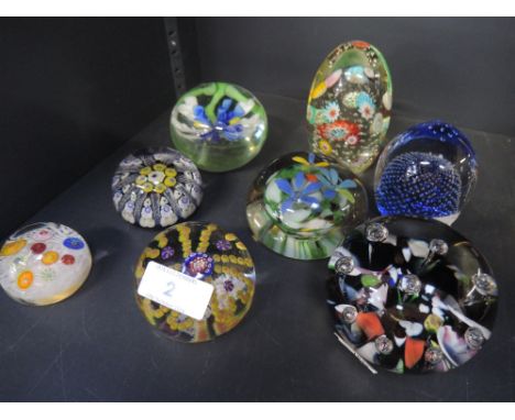 A selection of glass paperweights including Caithness