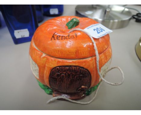 A piece of ceramic Kendal souvenir ware in the form of a pumpkin string dispenser