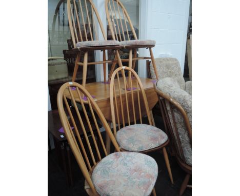 An Ercol drop leaf table and 4 spindle back chairs