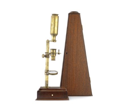 A George Adams brass Cuff-type microscope, English,signed G. Adams N° 60 Fleet Street London, on mahogany base with accessory