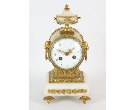 French gilt bronze and white marble mantel clock, by repute from Maples, Paris, 19th Century, with urn finial and rams head h