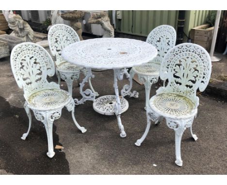 Victorian style pierced aluminium garden table H73 x D91cm and four similar chairs, H86cm