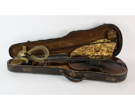 Violin, with lions head carved scroll and portrait medallion to the back, with titling C de S, 60cm long overall, the bow, un