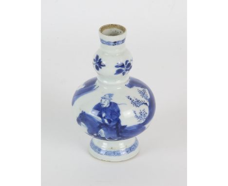 A small blue and white vase, decorated with horsemen, 10 cm high, Qing Dynasty; together with an associated wood stand [2]Con