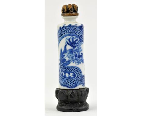 A blue and white Chinese snuff bottle with unglazed base, decorated with a coiled, five-clawed dragon, 7cm highProvenance: Th