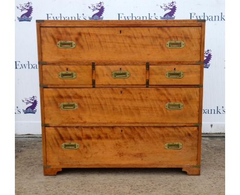 Satinwood military chest, 19th Century, with secretaire drawer, with red leather writing surface and an arrangement of pigeon