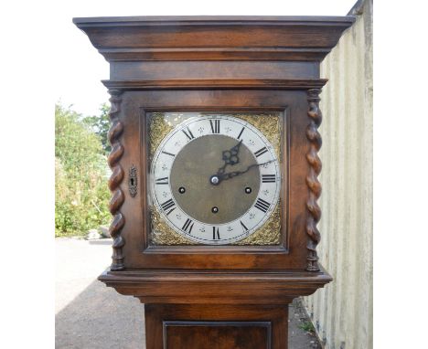 Walnut Grandmother clock. 20th Century, the silver dial with Roman and Arabic numeral chapter ring, with gilt brass spandrels