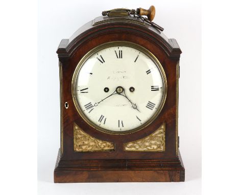 William IV mahogany mantle clock, with arched top and pierced brass sound boards, on a plinth base, white painted dial with R