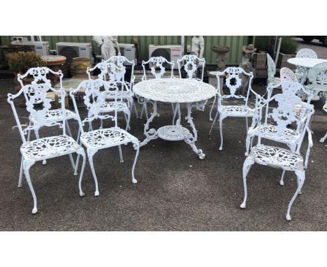 Victorian style pierced aluminium garden table H73 x D91cm and six arm chairs four similar chairs, H90cm