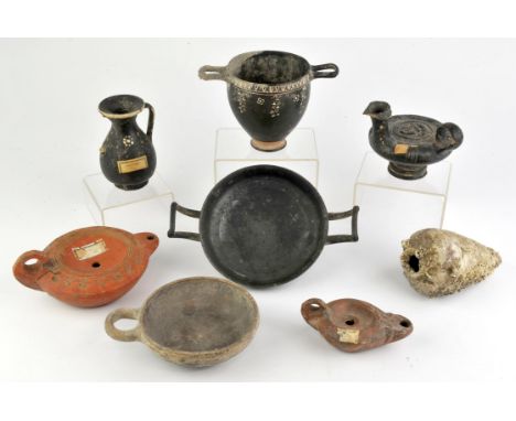 A quantity of Antiquities, to comprise South Italian black-glazed kylix, circa 4th Century BC, 20cm diam to include handles, 