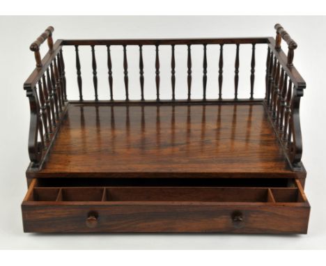 A Late Regency/William rosewood book carrier, with turned handles and spindles to the three-quarter gallery, above a single d