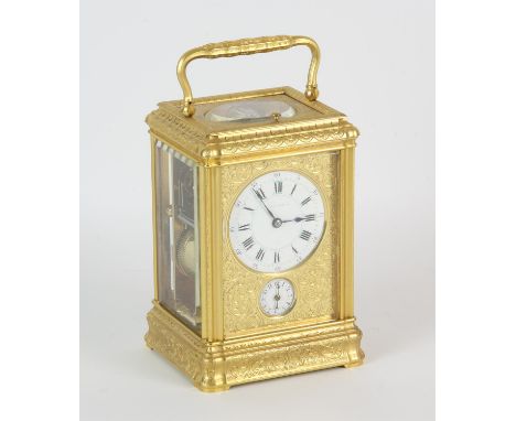 French carriage clock, 19th Century, the gorge case and face plate richly engraved with leaf and scroll work. The white ename