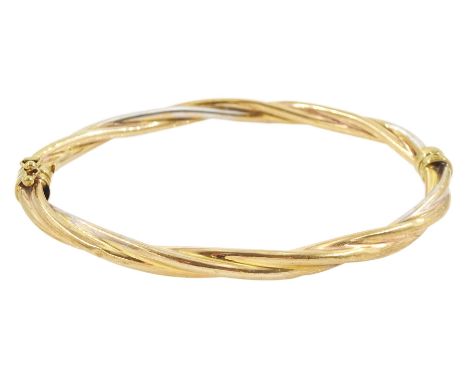 9ct gold twist hinged bangle, hallmarkedCondition Report:Approx 6.85gm, hollow interior, inner circumference = 18.5cm, some d