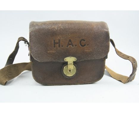 A WWI ERA BROWN LEATHER CARRY SATCHEL, marked on flap in large initials H.A.C. (Honourable Artillery Company), containing spe