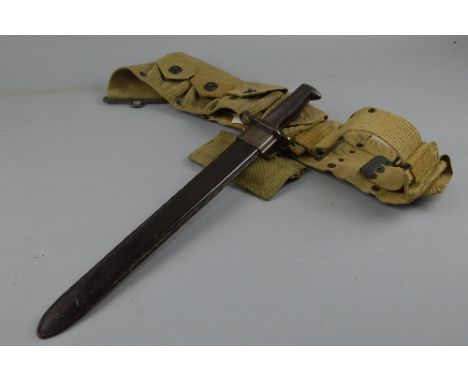 A US MILITARY ISSUE WWII ERA BAYONET, by RIA (Rock Island Arsenal) 1918, together with metal US scabbard and canvas webbing f