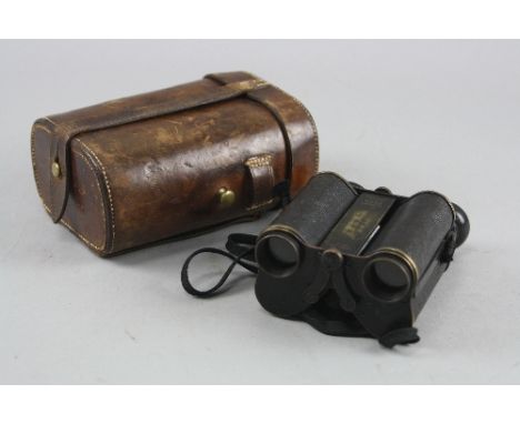 A PAIR OF BLACK COLOURED 'ROSS' LONDON BINOCULARS, in brown leather case, the body is engraved 'J.W.C. Kirk' DCLI (Duke of Co