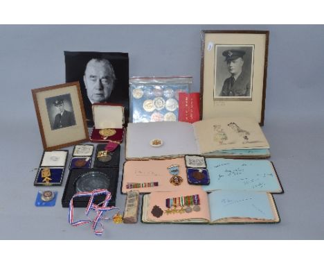 AN ARCHIVE OF MEDALS, MEDALLIONS, PHOTOS AND EPHEMERA, all related to Ivan Luckin, known to many as the man who sold 'London 