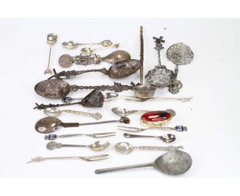 A Dutch white metal spoon, having a shaped bowl pierced with birds and flowers, with windmill terminal; together with various