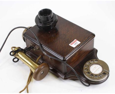 A vintage style oak cased rotary telephone