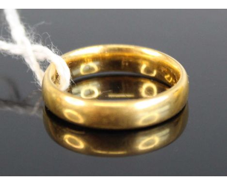 A 22ct gold wedding band, sponsor WW, 5.4g, size K/L