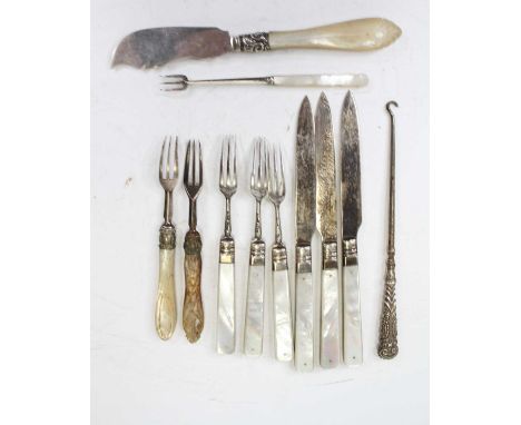 A Victorian butter knife, having a shaped silver blade and mother of pearl handle; together with various other loose mother o