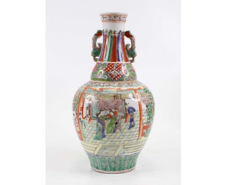 A Chinese porcelain vase,enamel decorated with figures within an interior scene, height 37cm