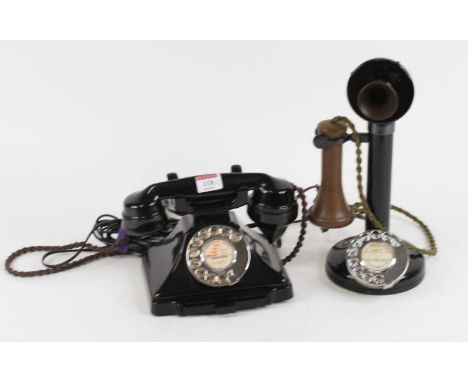A vintage bakelite rotary telephone; together with another similar (2)