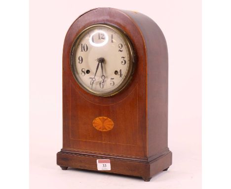 An early 20th century mahogany and boxwood strung 8-day mantel clock, the silvered dial showing Arabic numerals, height 34.5c