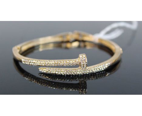 A gilt metal and paste set bangle, 6cm