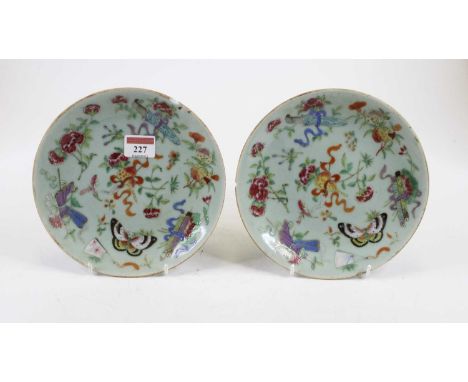 A pair of 19th century Chinese celadon plates, each enamel decorated with flowers and insects, dia. 19.5cm