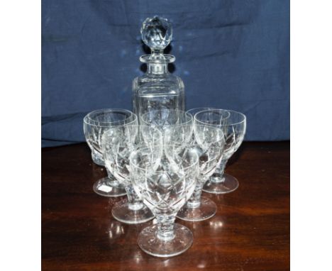 A decanter together with two whisky tumblers and six wine glasses