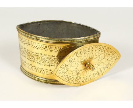A REGENCY "NAVETTE STYLE" ENGRAVED BRASS TEA CADDY AND COVER. 18cms long.