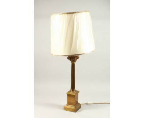 A BRASS CORINTHIAN COLUMN CANDLESTICK, as a lamp with a shade. 52cms high.
