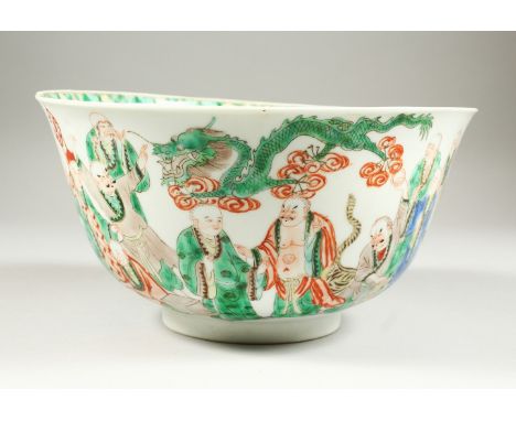 A CHINESE KANGXI PERIOD FAMILLE VERTE PORCELAIN BOWL, circa 1700, of larger than average size, the sides painted with an asse