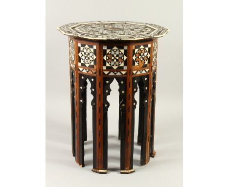 A MOORISH MOTHER-OF-PEARL AND EBONY INLAID TABLE 40cms x 50cms high.