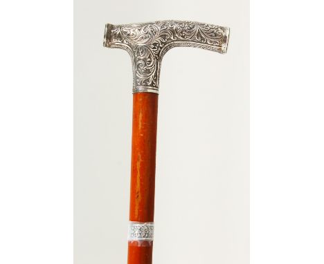 A VICTORIAN ISLAMIC WALKING STICK, with silver handle with calligraphy. 86cms long.