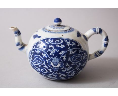 A CHINESE KANGXI BLUE &amp; WHITE WINE POT AND COVER, decorated with formal scroll and vine decoration, the spout and handle 