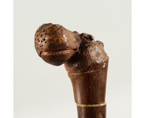 AN EDWARDIAN WALKING STICK, the handle carved as a HIPPOPOTAMUS. 93cms long.