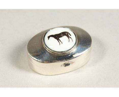 A SILVER AND ENAMEL HORSE PILL BOX.