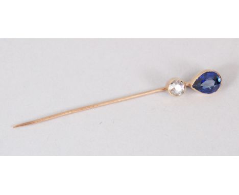A DIAMOND AND SAPPHIRE STICK PIN.