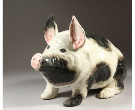 A LARGE WEMYSS PIG,  naturalistically modelled in black and white. Impressed WEMYSS WARE, R. H. &amp; S. RETAILED BY T. GOODE