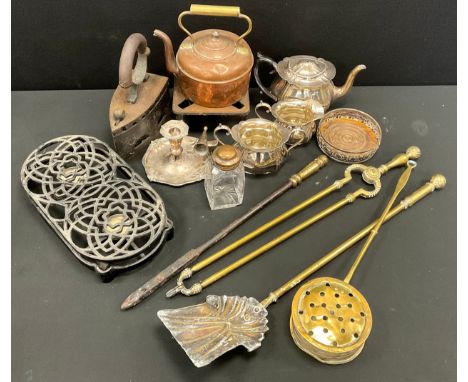 A Victorian cast iron coal iron, plate warmer, three piece silver plated tea set, chamber stick, brass fire irons, etc.
