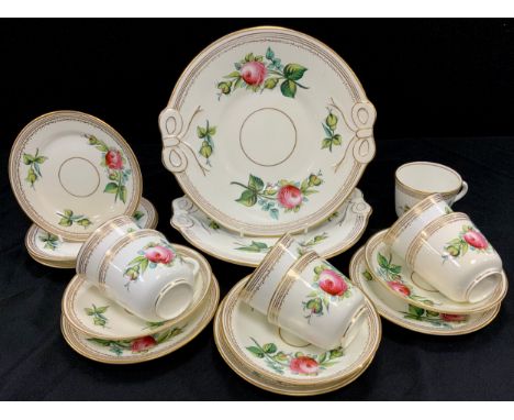 An early 20th century part tea service, painted with red roses, comprised of; two picnic roses; seven teacups, three saucers,